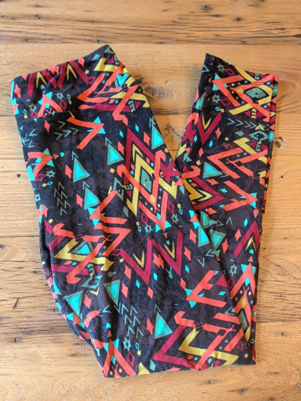 LuLaRoe Brown Leggings with Red, Teal & Yellow Geometric Print